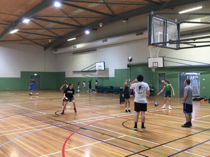 Friday Hoops players warming up and running training drills before the game
